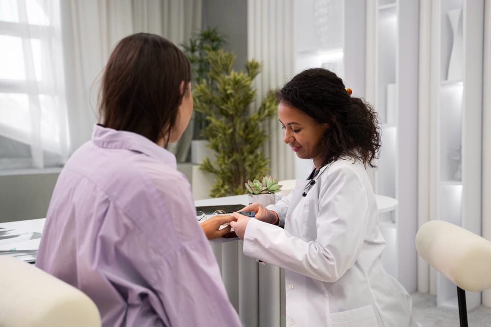Doctor checking a patient’s wrist during a consultation